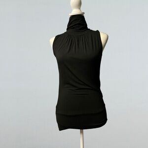 NWT. Unica Mock Neck Backless Top